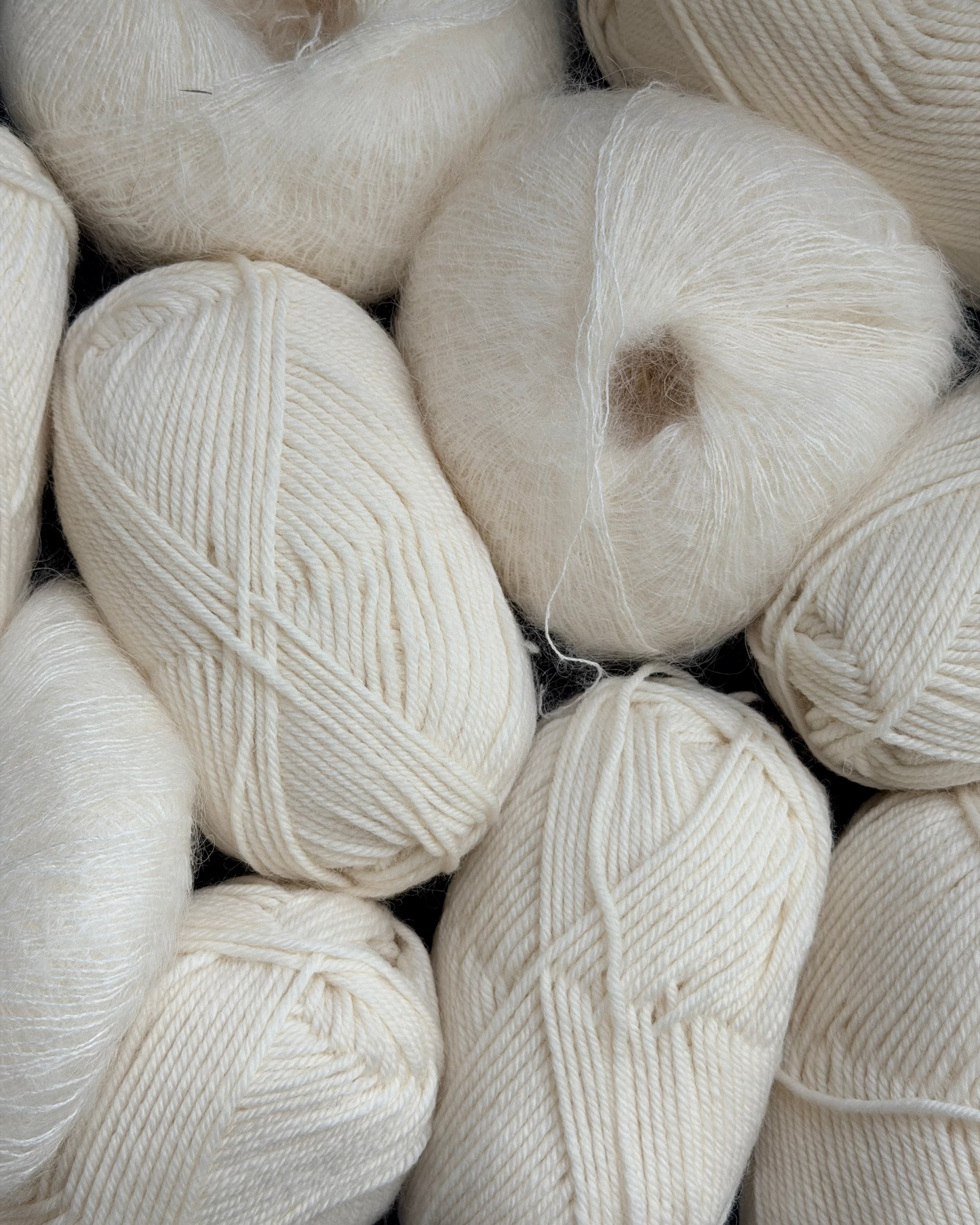 Close-up of cream-colored yarn balls
